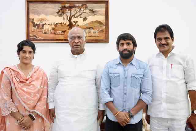 Wrestler Vinesh Phogat and Bajrang Punia with Congress chief Kharge